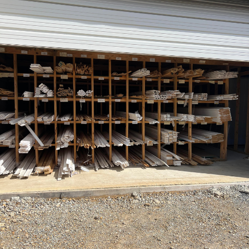Stacked lumber and trim outside of Fayetteville Lumber & Supply