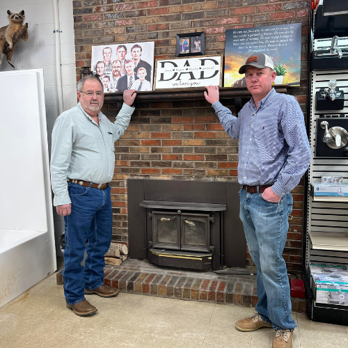 the owner and management posing inside of Fayetteville Lumber & Supply